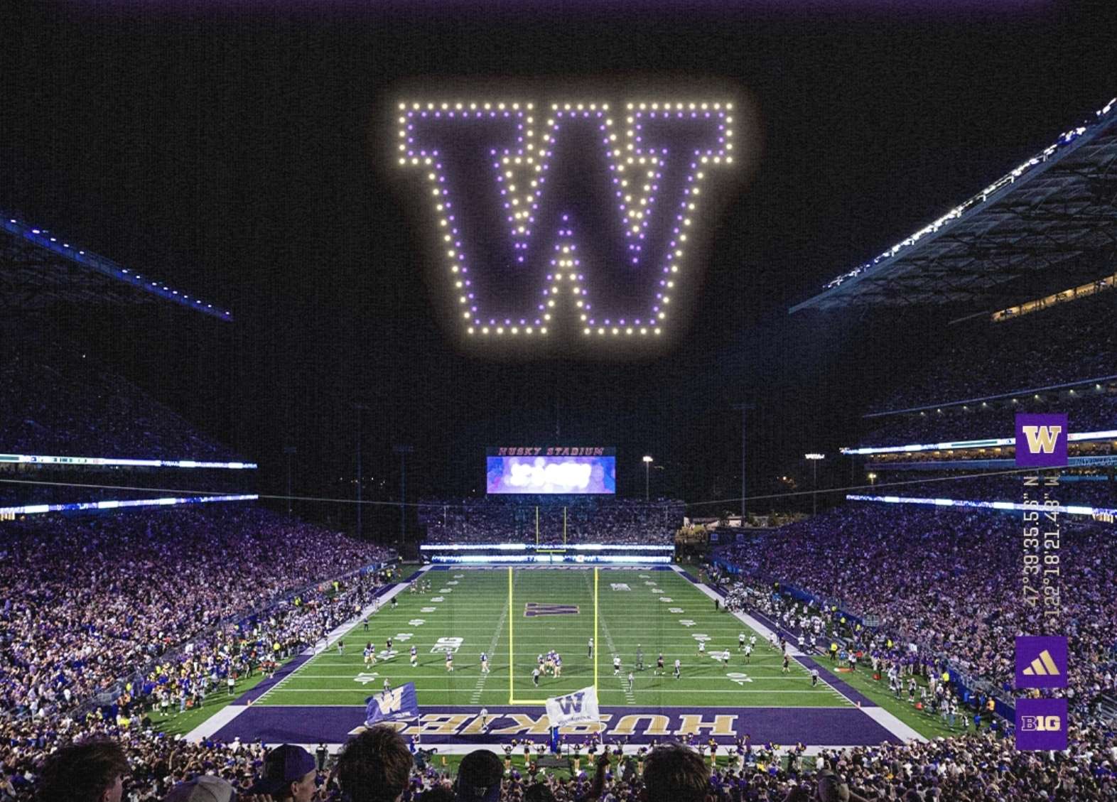 Husky Stadium at night with a drone-light W above the field